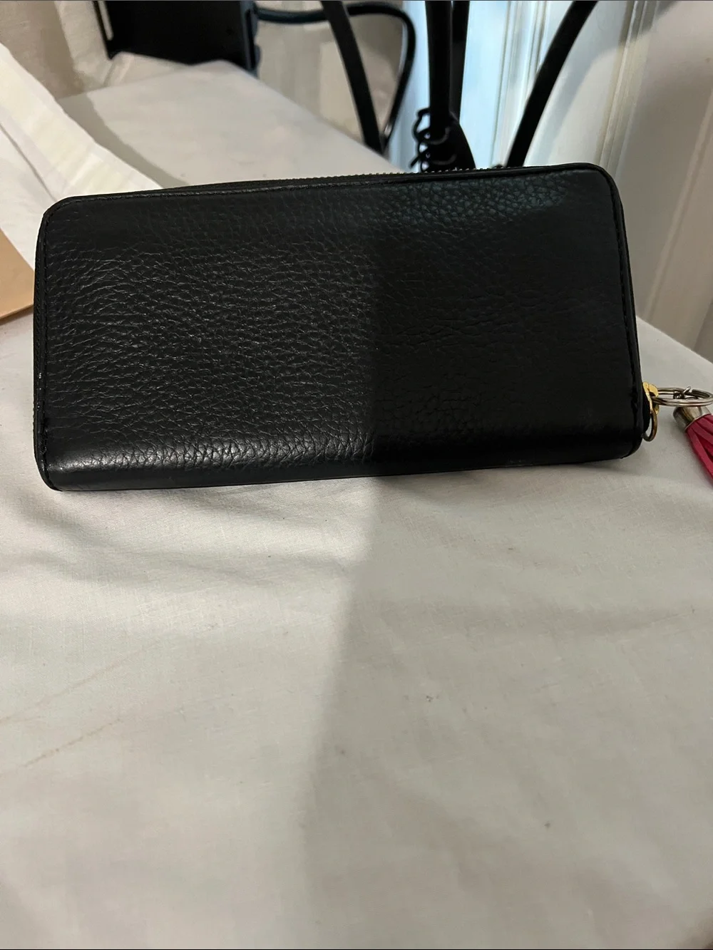 Fossil Black Leather Wristlet Wallet with Pink Tassel Charm